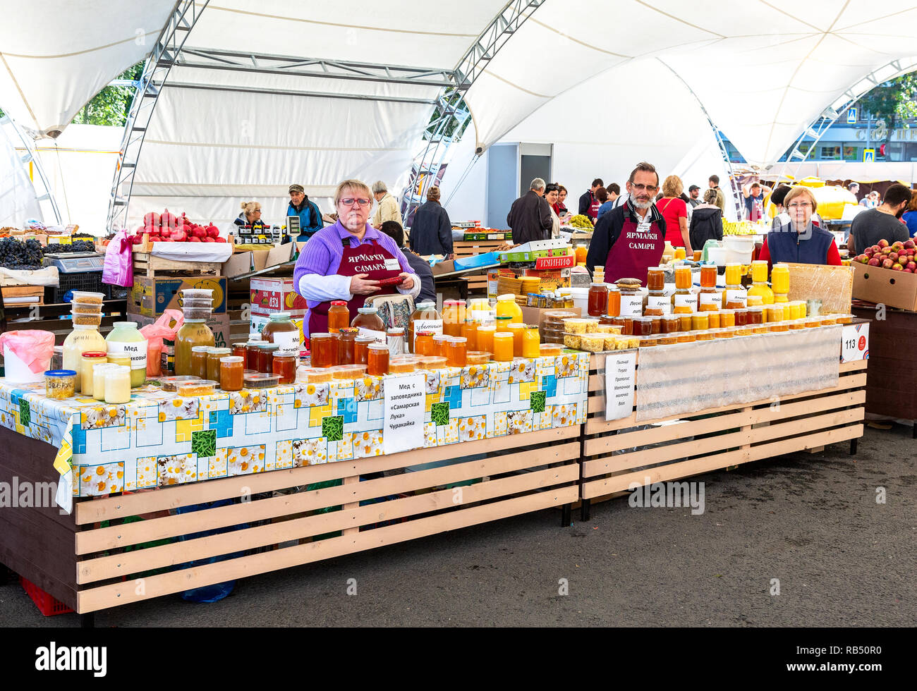 Samara, Russia - September 22, 2018: Sweet fresh honey and other produce selling at the traditional farmers market Stock Photo