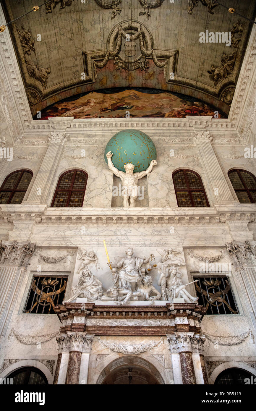 The Netherlands, Amsterdam, Dam Square. Royal Palace. Interior. Burgerzaal or Citizens' Hall. Statue of Atlas carrying the globe. Stock Photo
