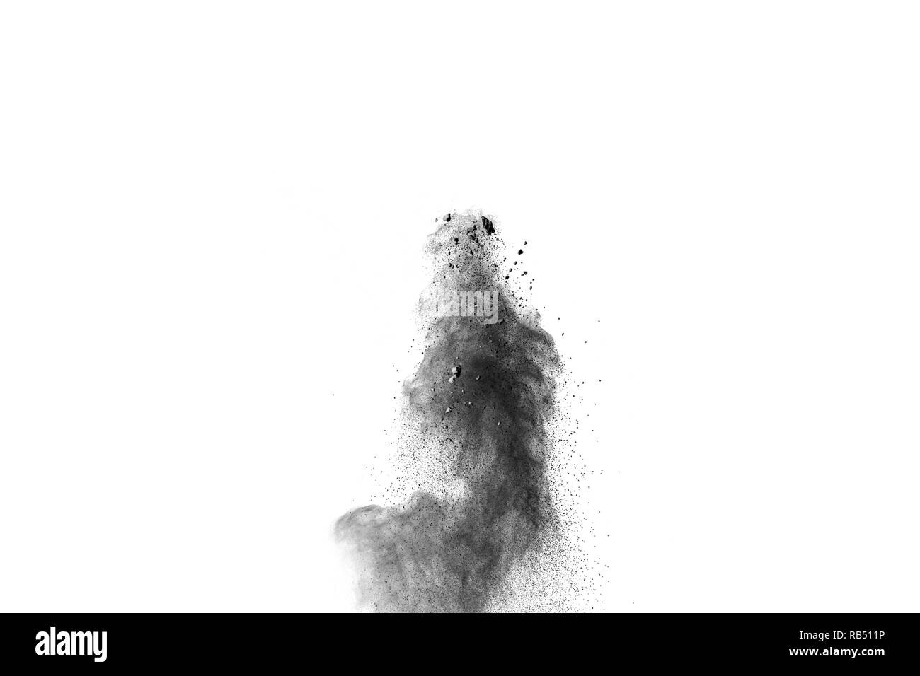 Black powder explosion against white background. Charcoal dust particle