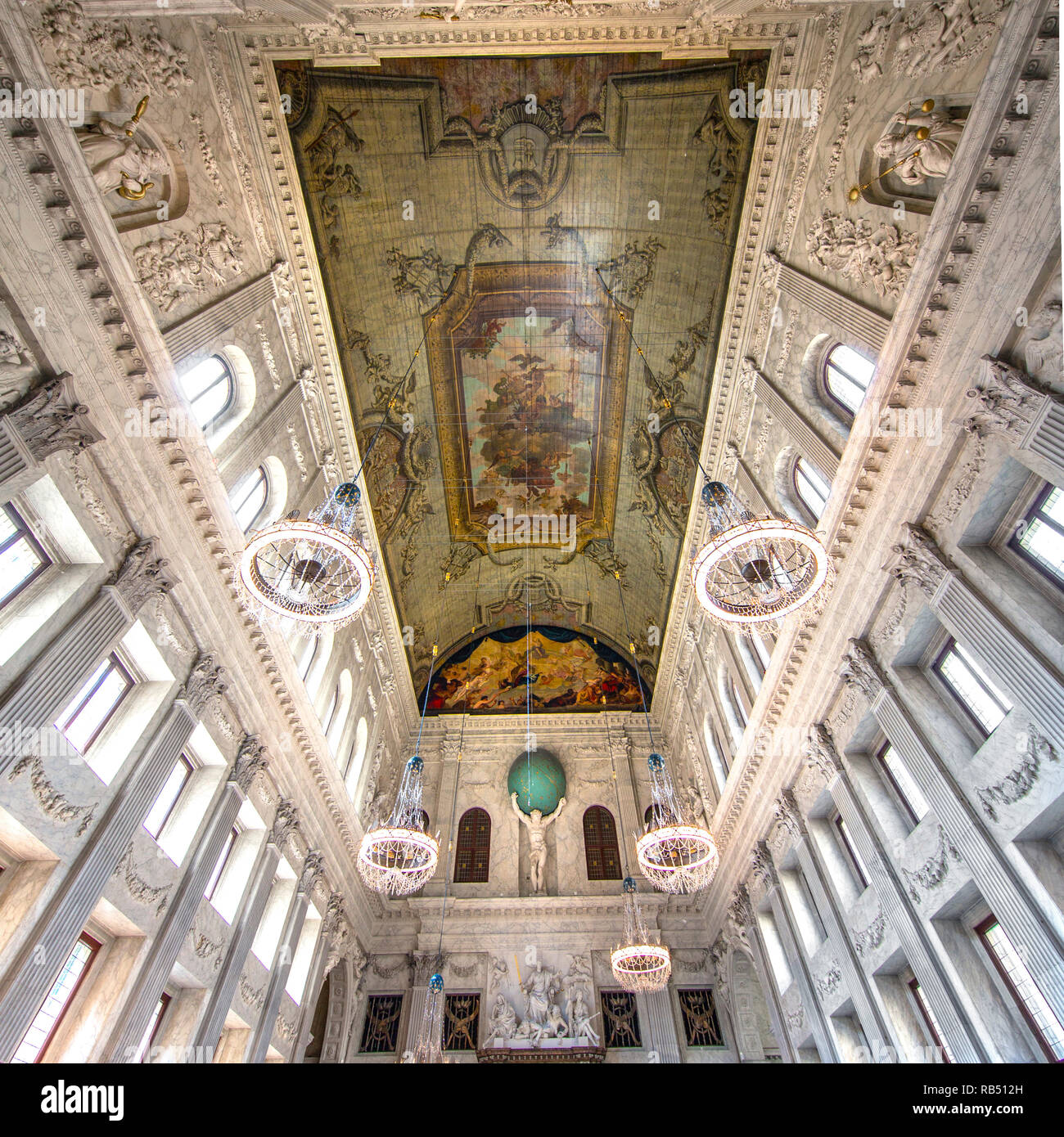 The Netherlands, Amsterdam, Dam Square. Royal Palace. Interior. Burgerzaal or Citizens' Hall. Statue of Atlas carrying the globe. Stock Photo