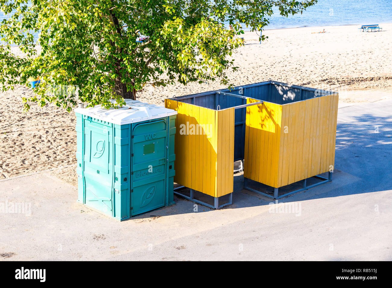 Samara, Russia - September 22, 2018: Beach changing room and mobile public toilet at the city beach on the shores of the Volga river Stock Photo