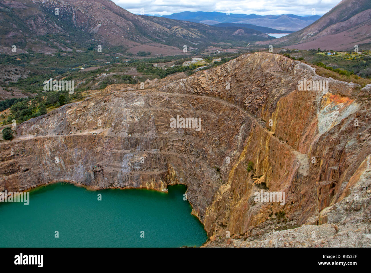 Lake inside the Iron Blow mine pit above Queenstown Stock Photo