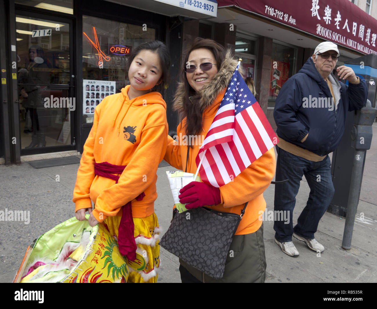 Young Lion dancer and her mom in the Bensonhurst section of Brooklyn on Chinese New Year, 2017. Stock Photo
