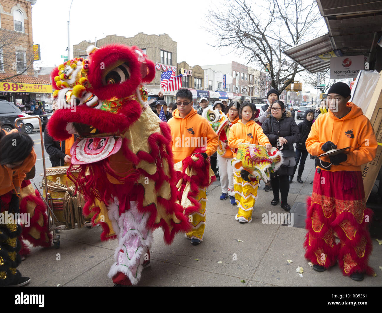 Troupe performs Lion Dance to bring good luck and prosperity to Chinese owned stores in the Bensonhurst section of Brooklyn on Chinese New Year, 2017. Stock Photo