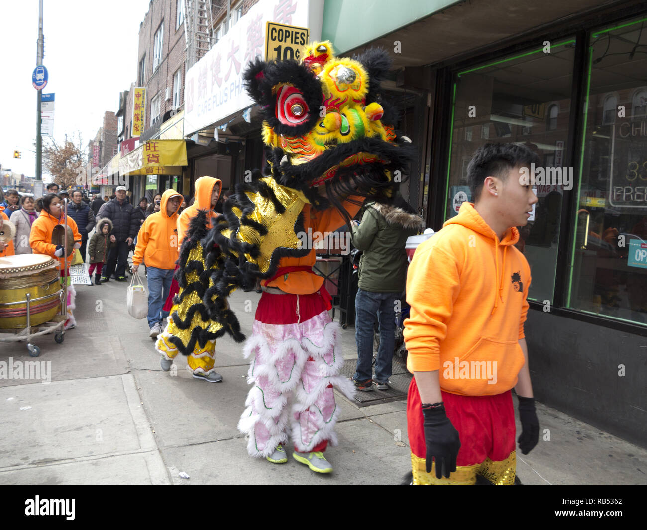 Lion dancers bring good luck and prosperity to Chinese owned stores in the Bensonhurst section of Brooklyn on Chinese New Year, 2017. Stock Photo