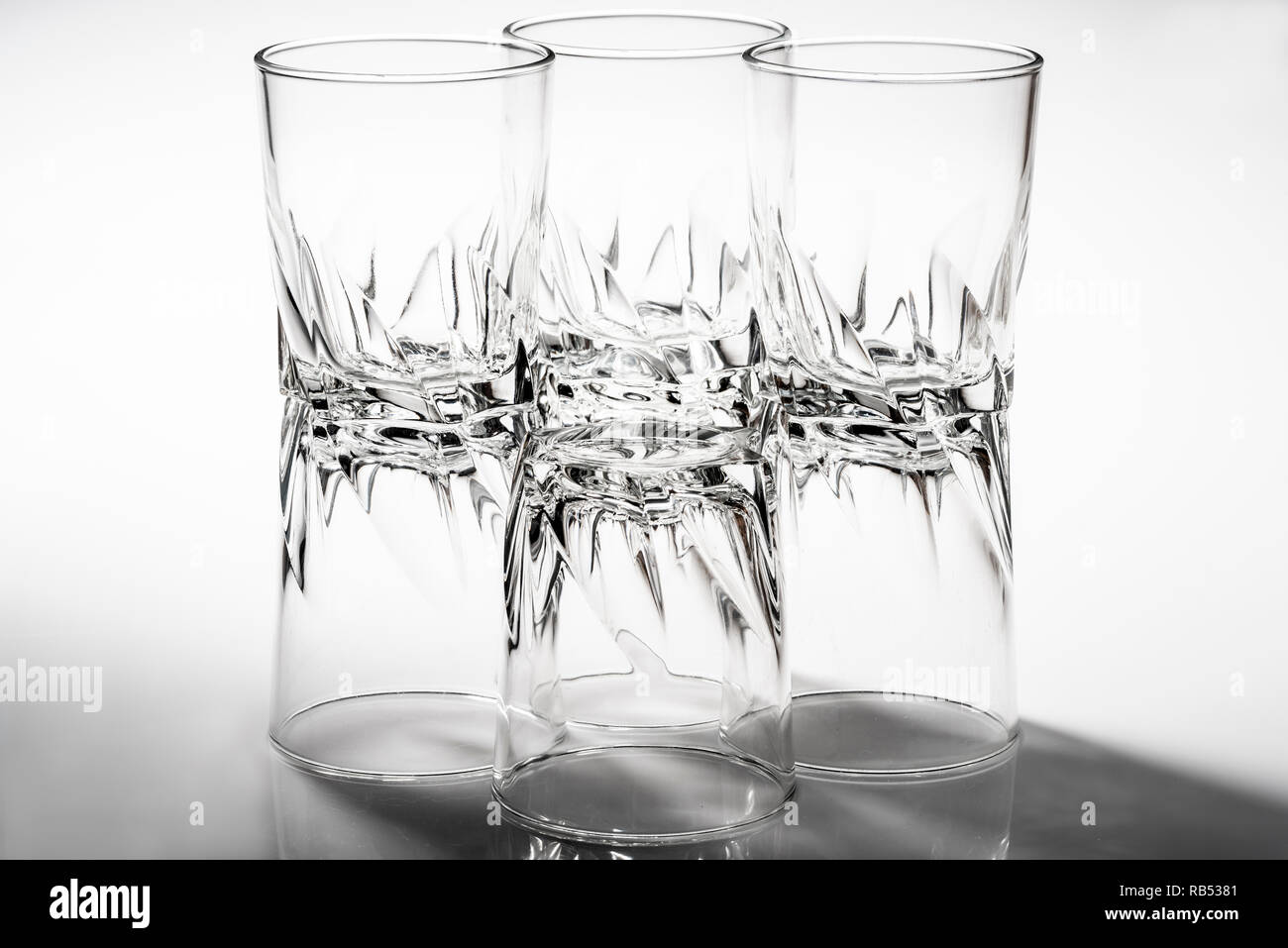 Group of glass tumblers with a heavy, chunky design. Stock Photo