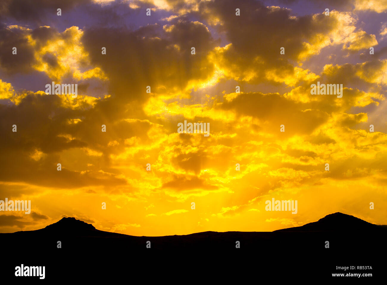 Fiery sunset over the Mountains Stock Photo