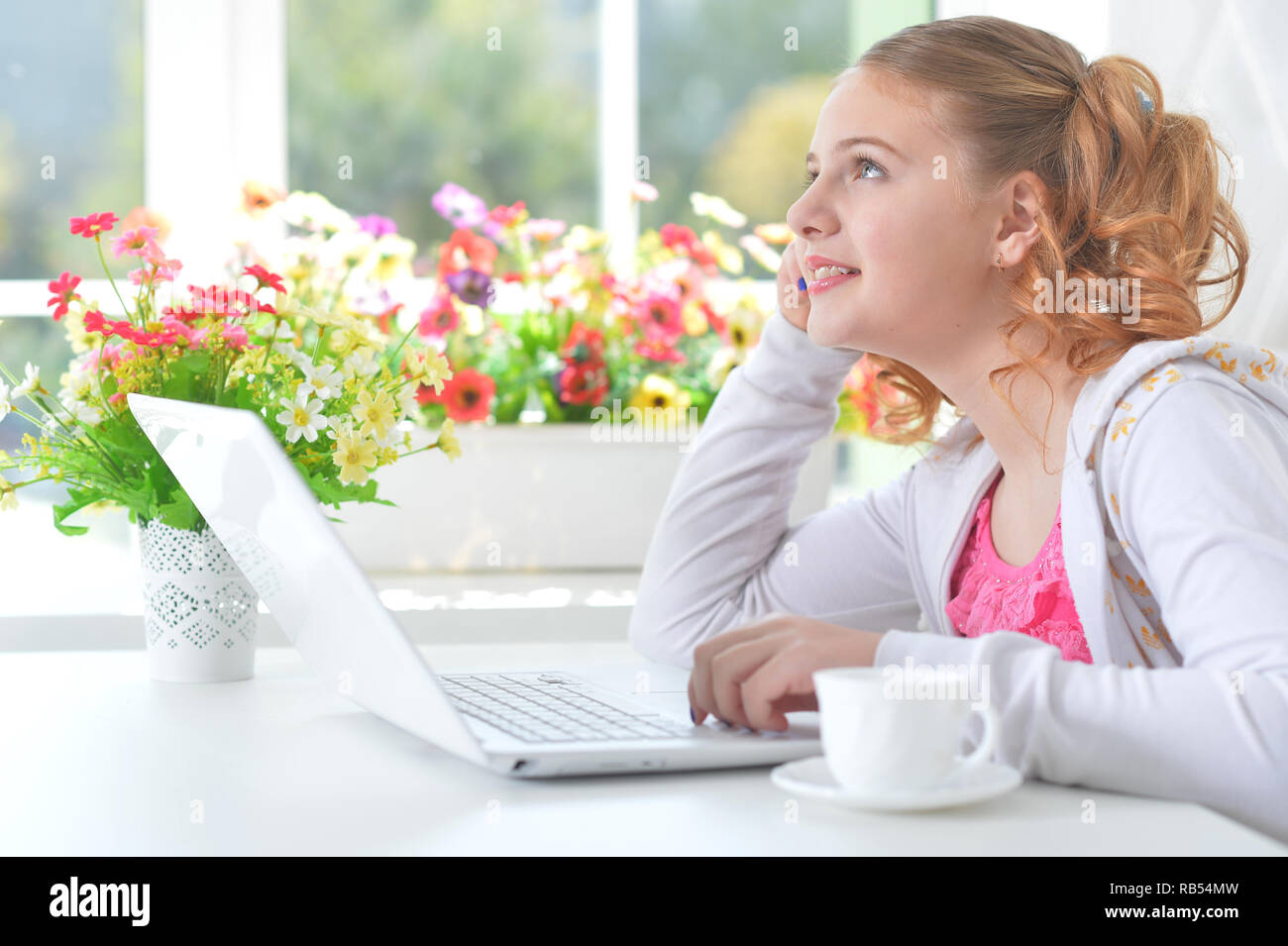 Portrait of little girl with modern laptop Stock Photo - Alamy