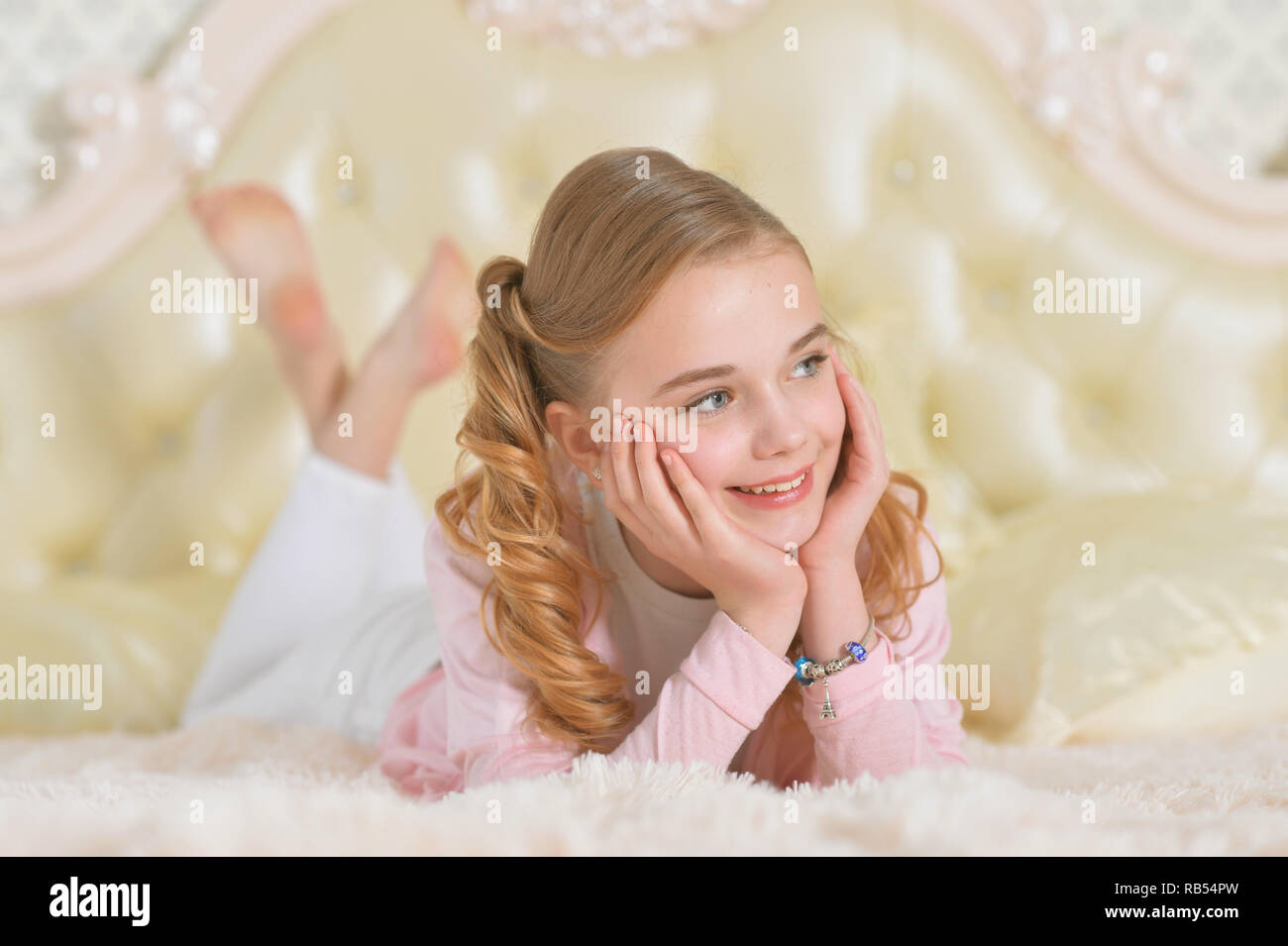 Preteen girl lying on bed hi-res stock photography and images - Alamy
