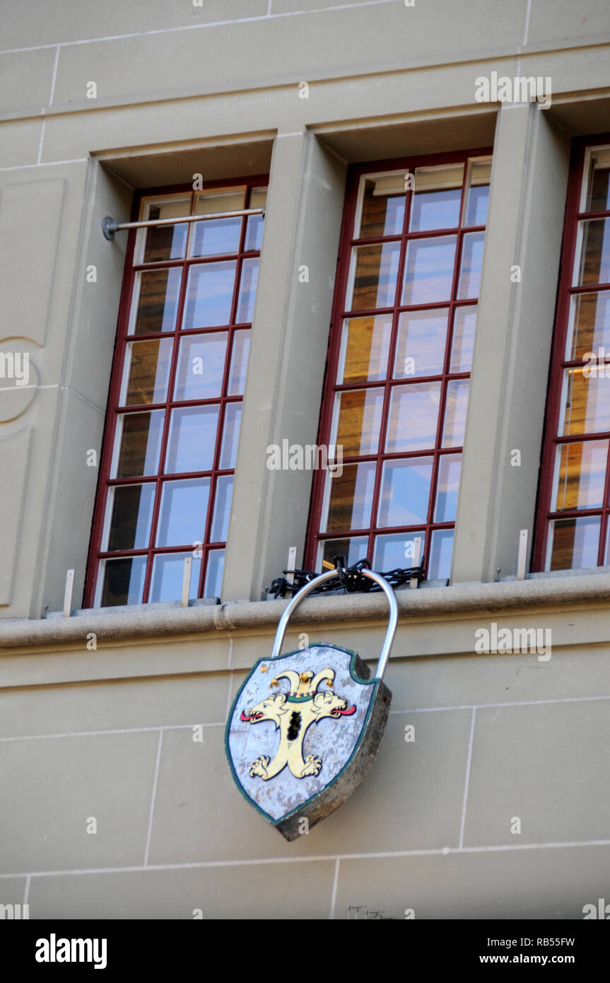 A lock and chain attached to one of the windows at the old Käfigturm Tower that was once a prison on Barenplatz, (Beer Place) in the Old Town of Bern Stock Photo