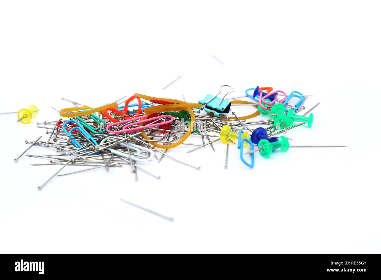 Portrait of paper pin and rubber band. Isolated on the white background ...