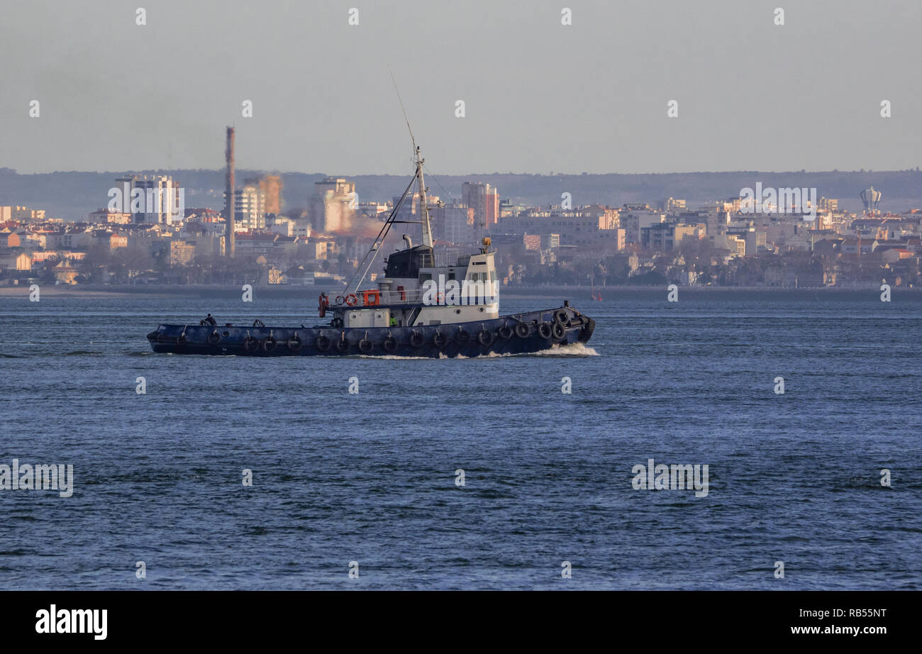 Lisbon - Portugal, tugboat navigating the Tagus River Stock Photo