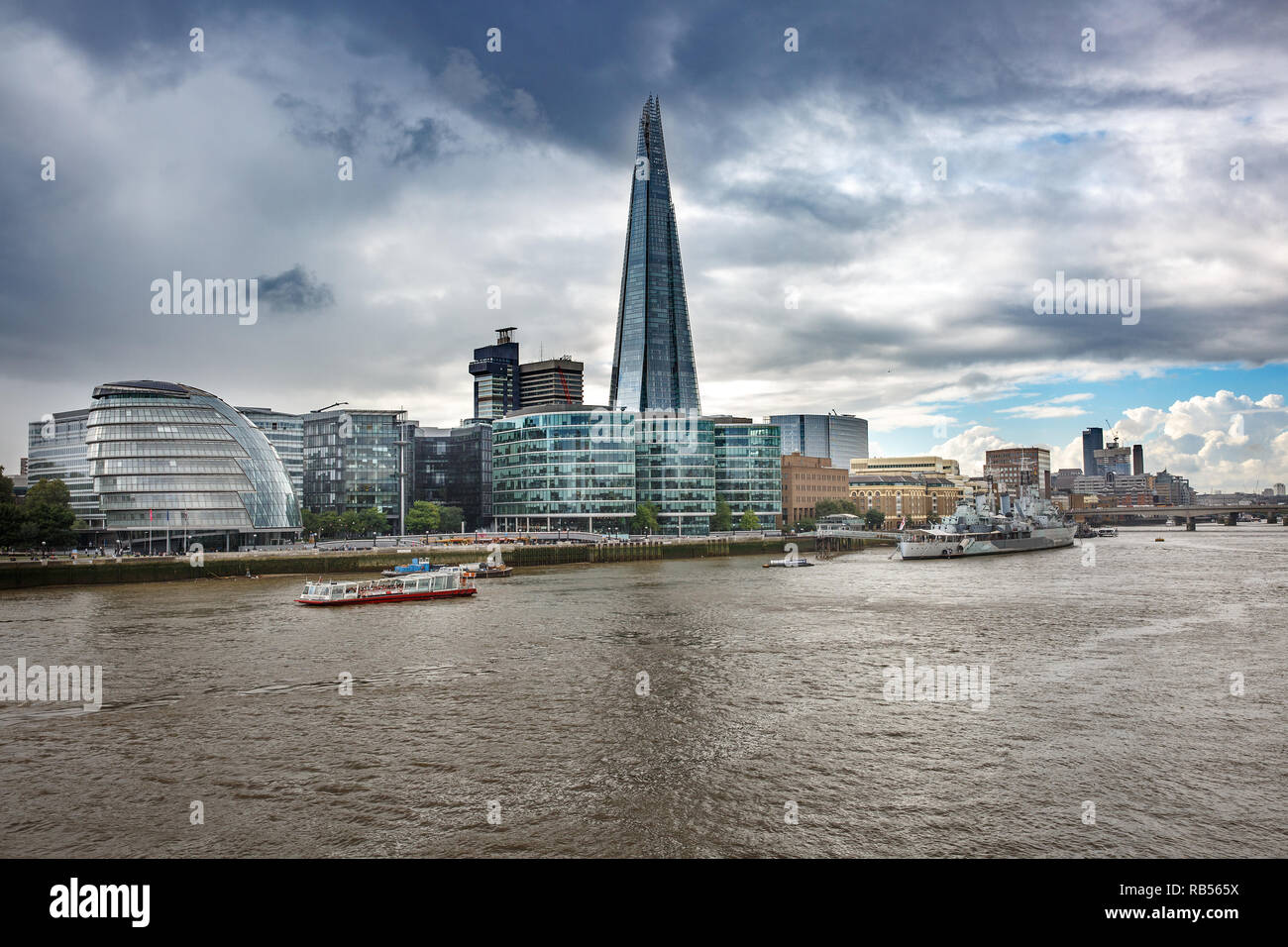 Skyscraper in London, Great Britain with Thames river in the foreground. Business, success, financial district, modern architecture and tourism sights Stock Photo