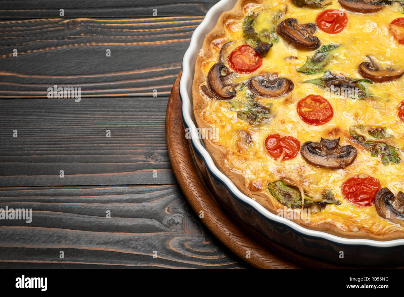 Baked homemade quiche pie in ceramic baking form Stock Photo Alamy
