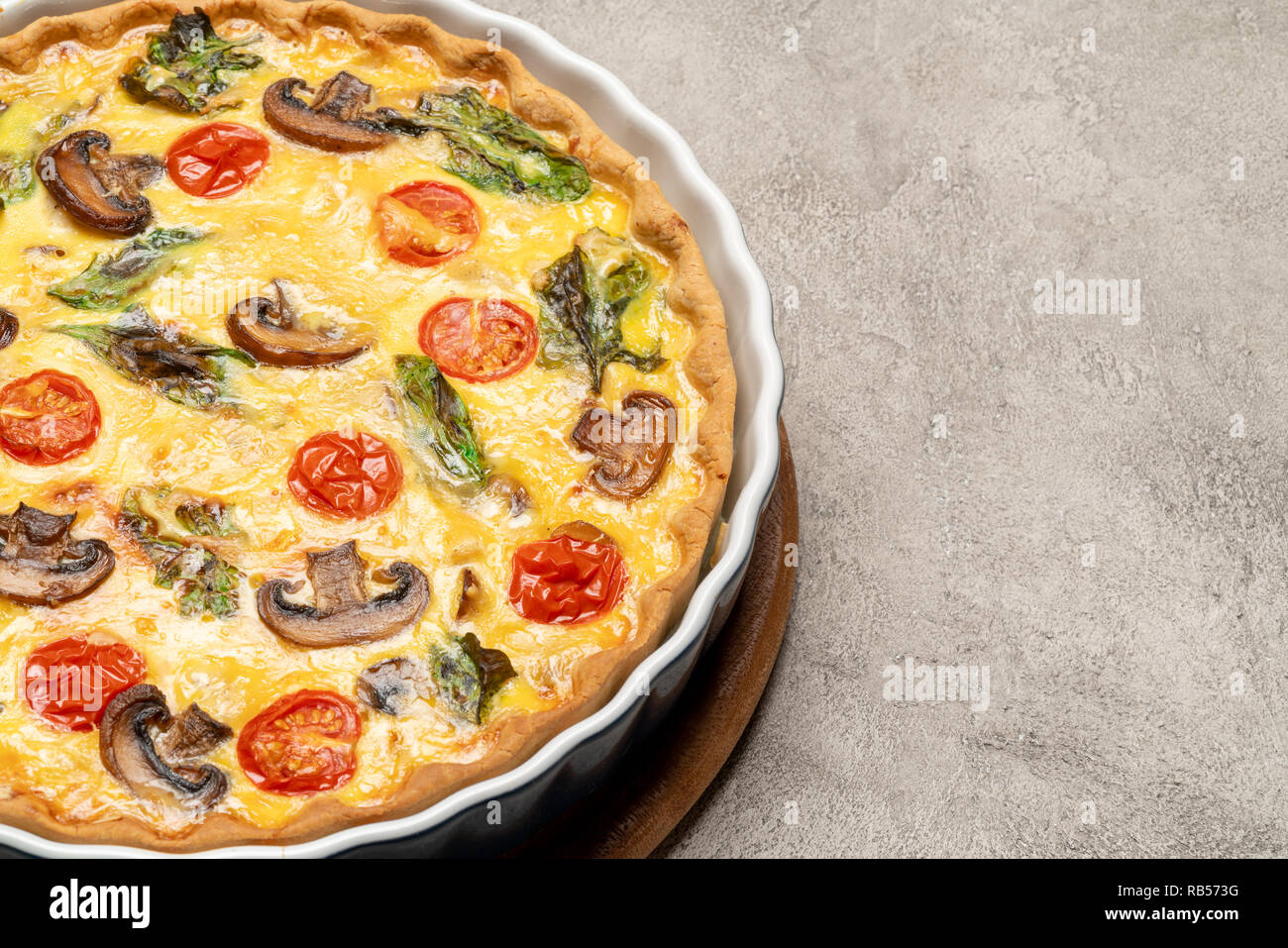 Baked homemade quiche pie in ceramic baking form Stock Photo Alamy