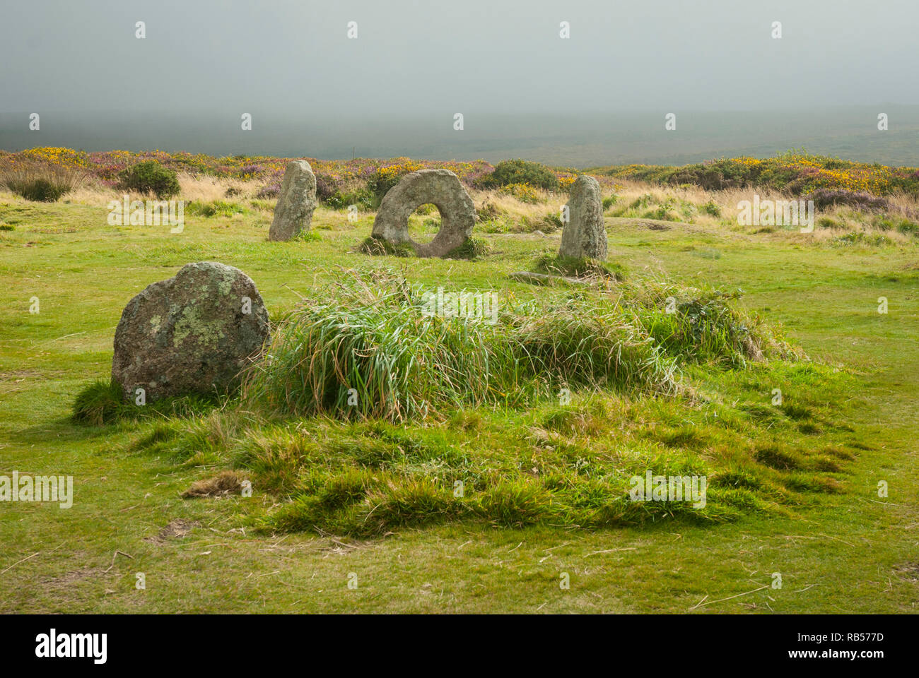 Near Lands End, Cornwall UK is the unique Men-an-tol megalithic monument. Three standing stones one which is 'holed' believed to be a fertility symbol Stock Photo