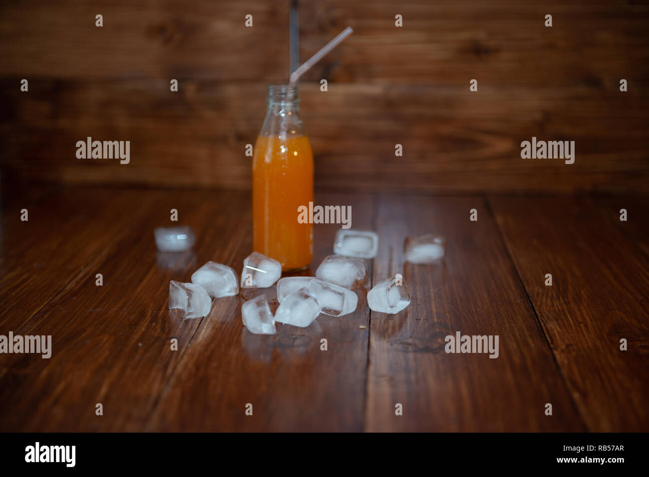 Ice fresh juice with ice cubes on table Stock Photo