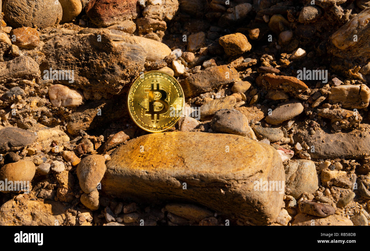 Crypto currency Gold Bitcoin, BTC, macro shot of Bitcoin coins on rock  background, bitcoin mining concept Stock Photo - Alamy
