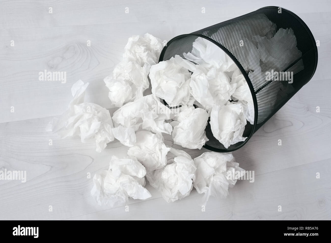 Office trash can full with documents on a white Stock Photo - Alamy