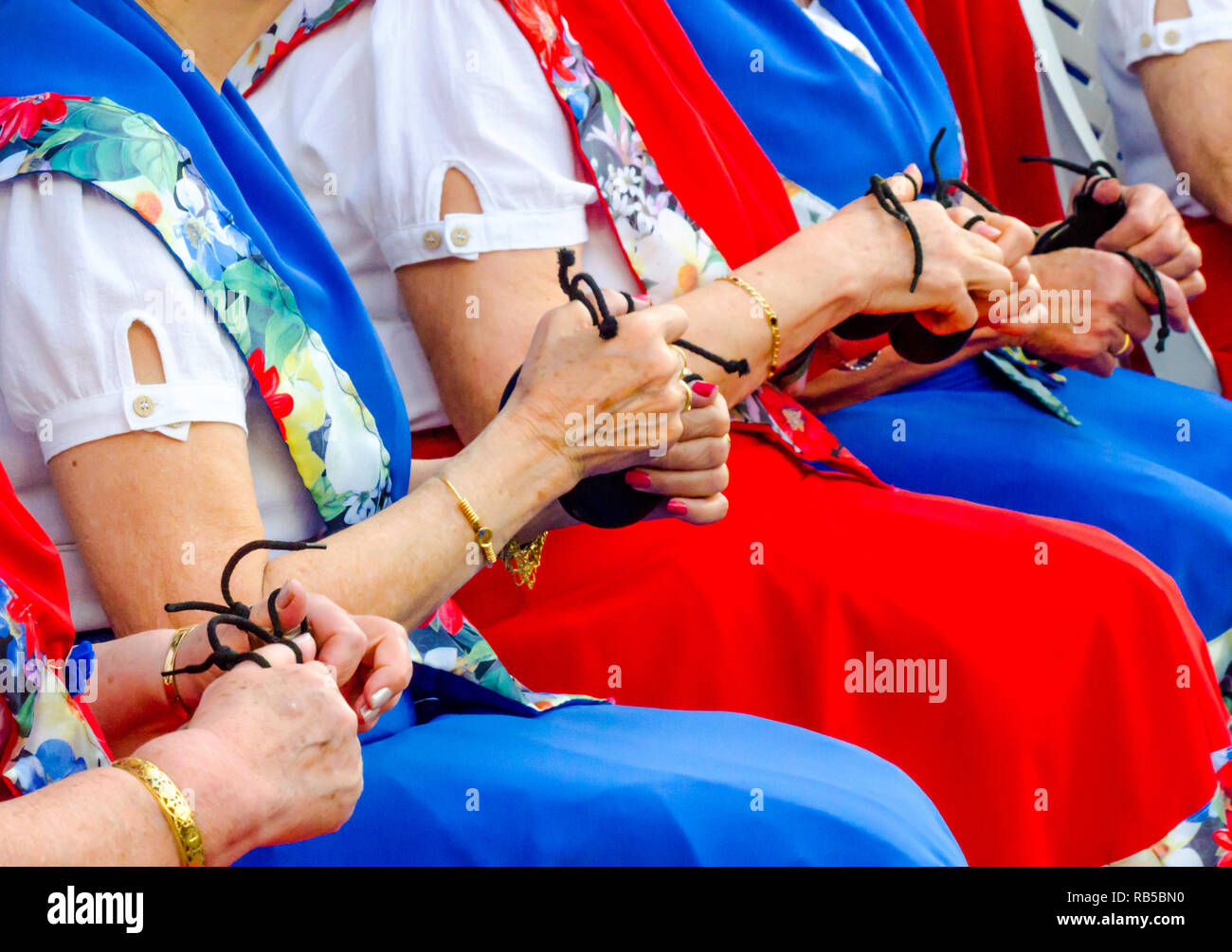 close up hands with castanets of women during the presentation of a ...