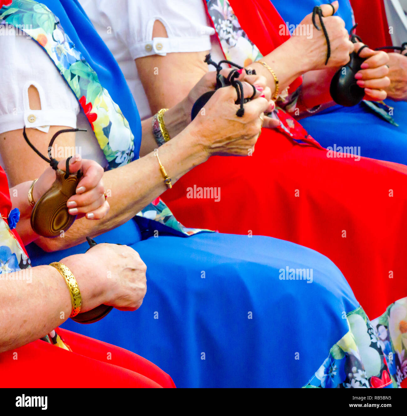 close up hands with castanets of women during the presentation of a ...