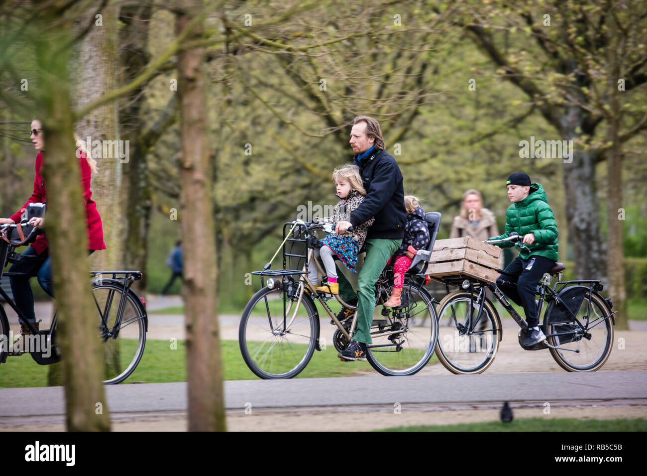 Father brings children to school by bicycle, Amsterdam, The Netherlands. Stock Photo