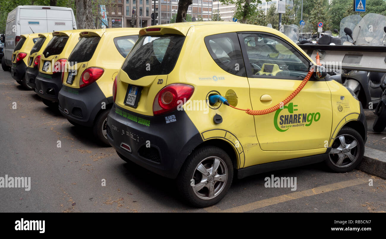 Share'ngo electric cars sharing vehicles parked at electric charging station outside Milan Main Railway station, Milan, Italy, Europe. Stock Photo