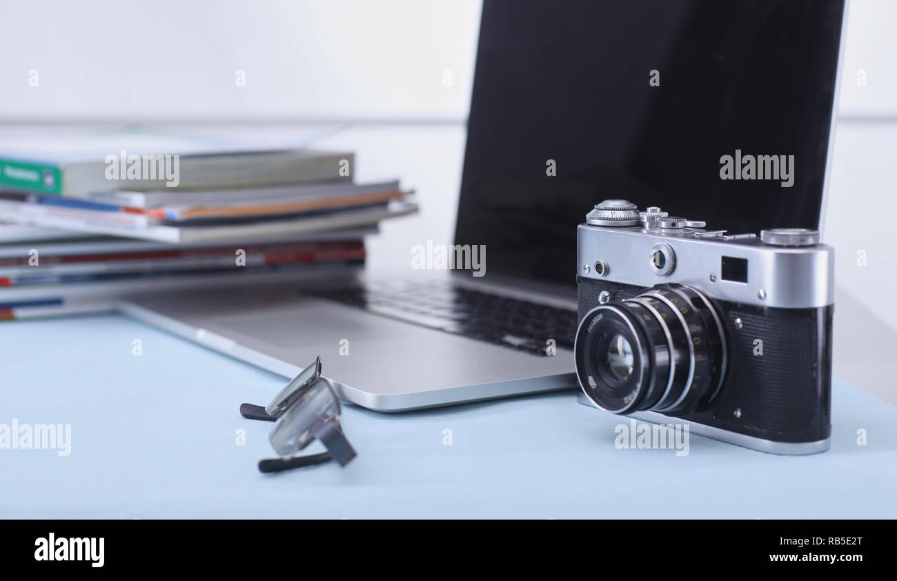 Computer keyboard, mouse and camera lie on table. Stock Photo