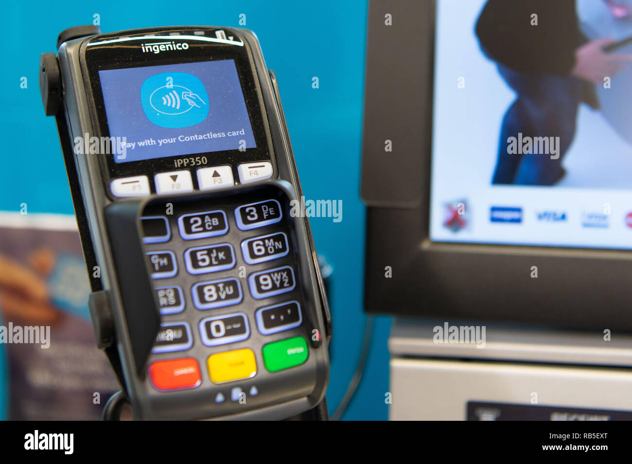 A contactless chip and pin payment terminal in a supermarket shop in