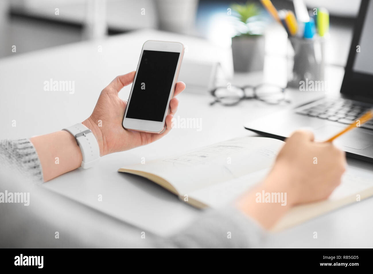 web designer working on smartphone user interface Stock Photo