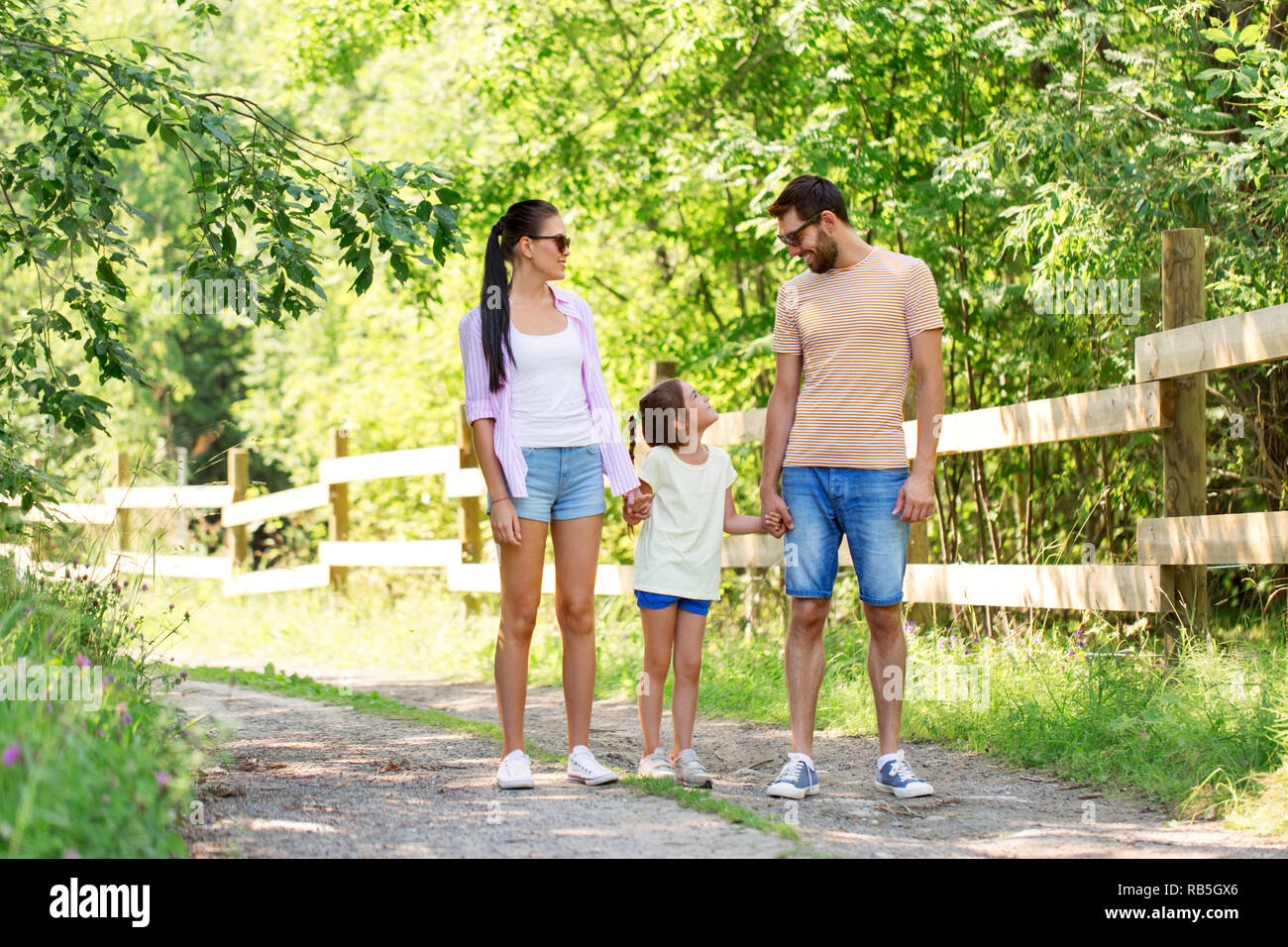 happy family walking in summer park Stock Photo - Alamy