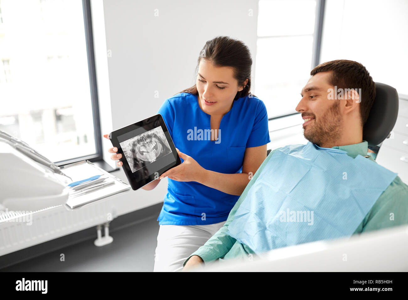 dentist showing panoramic dental xray to patient Stock Photo Alamy
