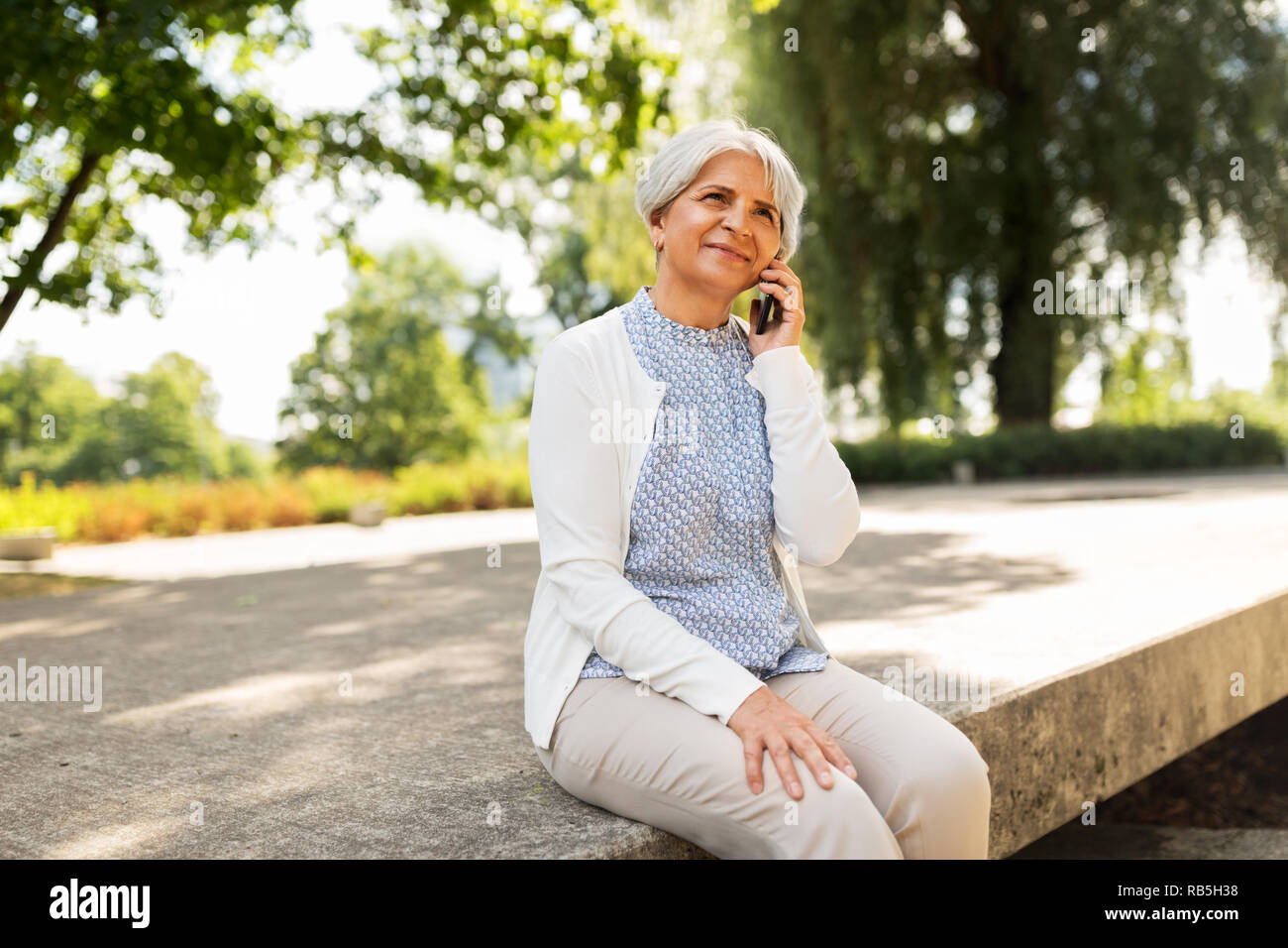 Happy mature woman calling hi-res stock photography and images - Alamy