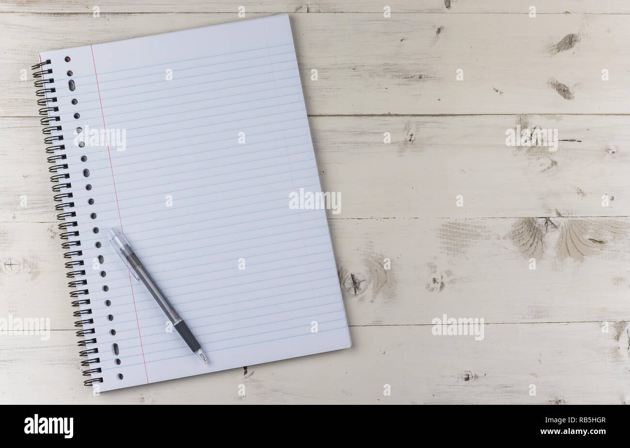 Notepad and pen on a white wooden table Stock Photo