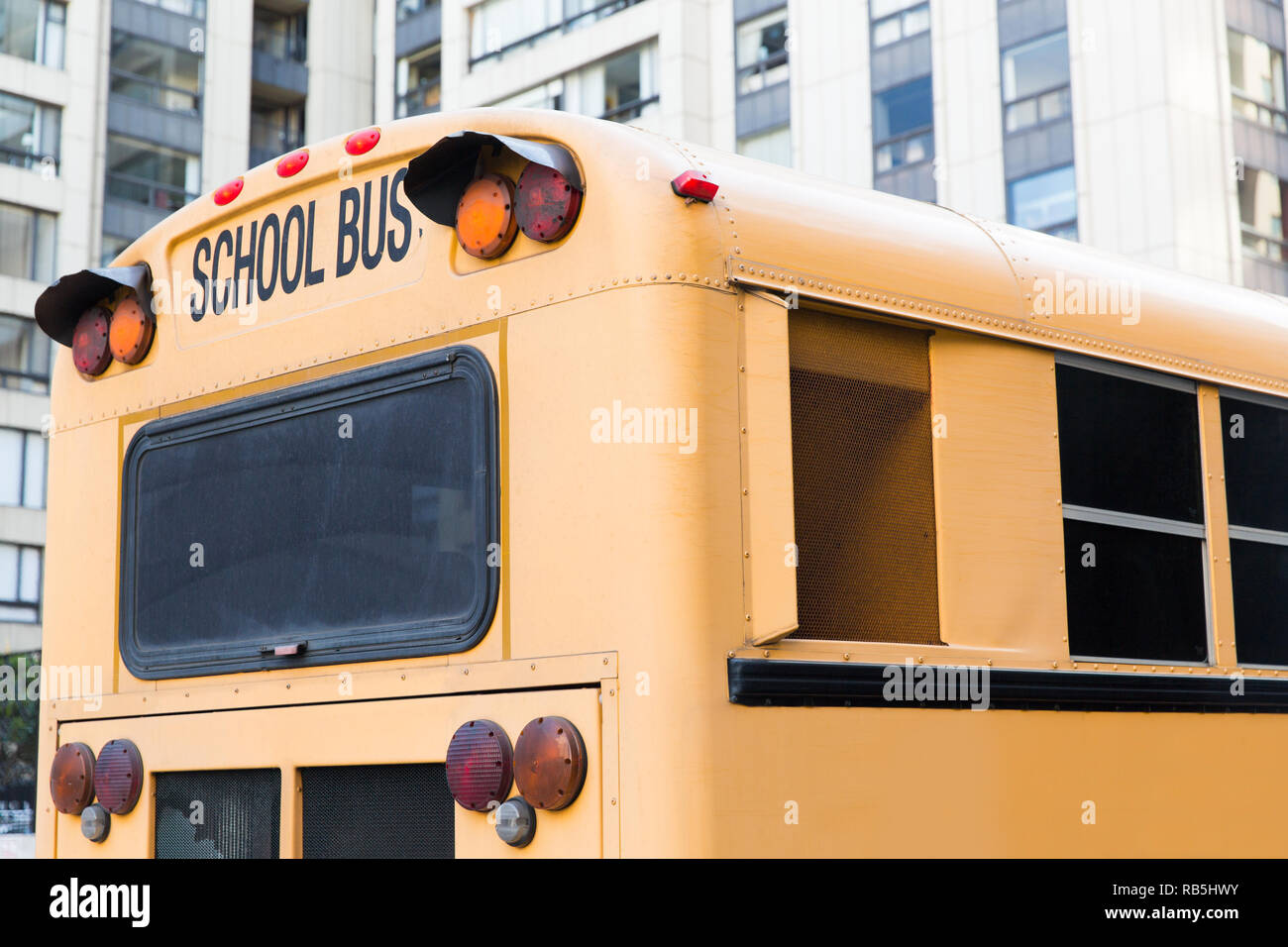 close up of american schoolbus on city street Stock Photo - Alamy