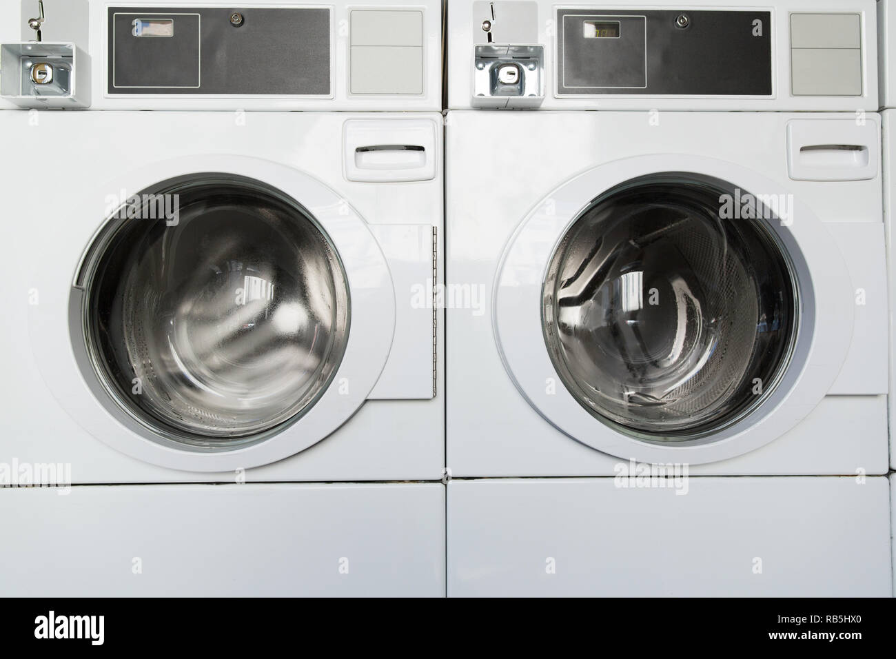 washing machines at laundromat Stock Photo