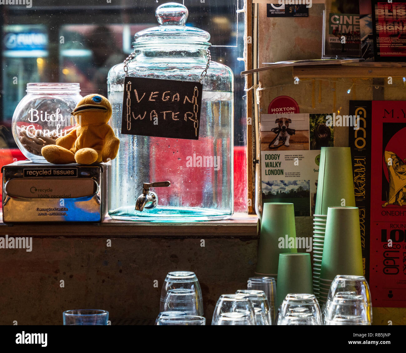 Vegan Water on offer in a coffee shop on Bethnal Green Road in London's East End. Stock Photo