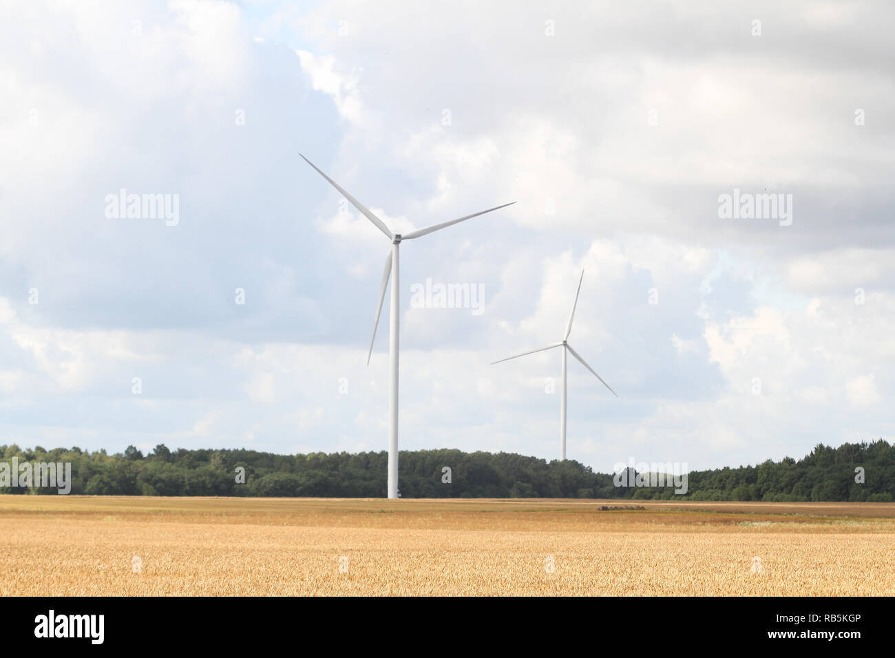 Beautiful countryside view of multiple wind park green energy turbines. Stock Photo