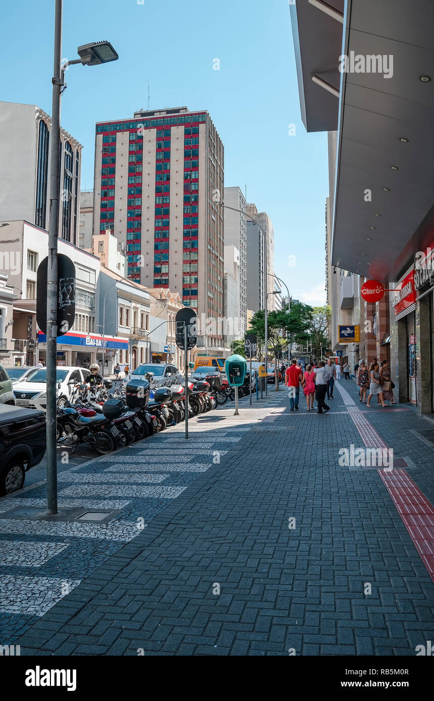 Curitiba - PR, Brazil - December 14, 2018: Downtowns sidewalk on the Marechal Deodoro street. Stores and people on the sidewalk. Stock Photo