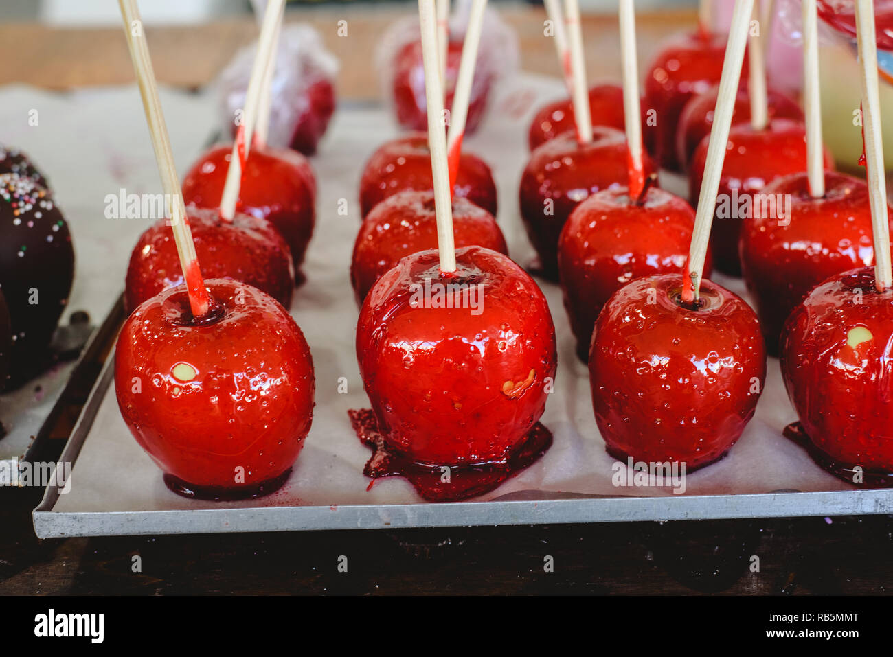 candy apple coated with red caramel candy for sale for kids Stock Photo