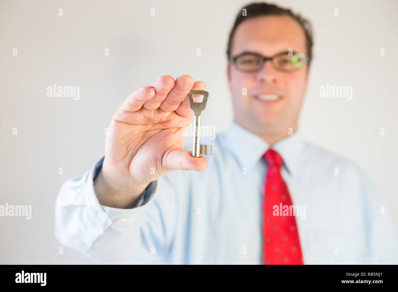 Business man with a key Stock Photo