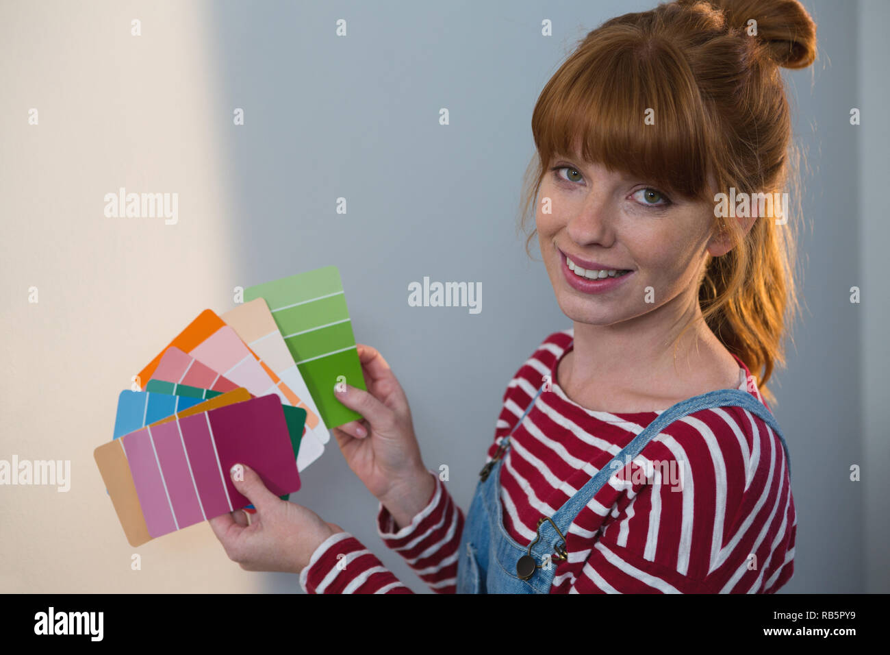 Female painter holding color palletes at home Stock Photo - Alamy