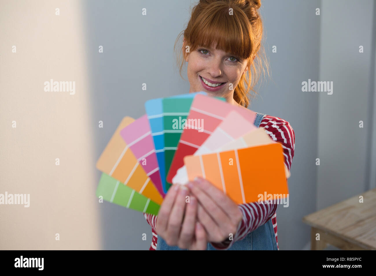Female painter holding color palletes at home Stock Photo - Alamy