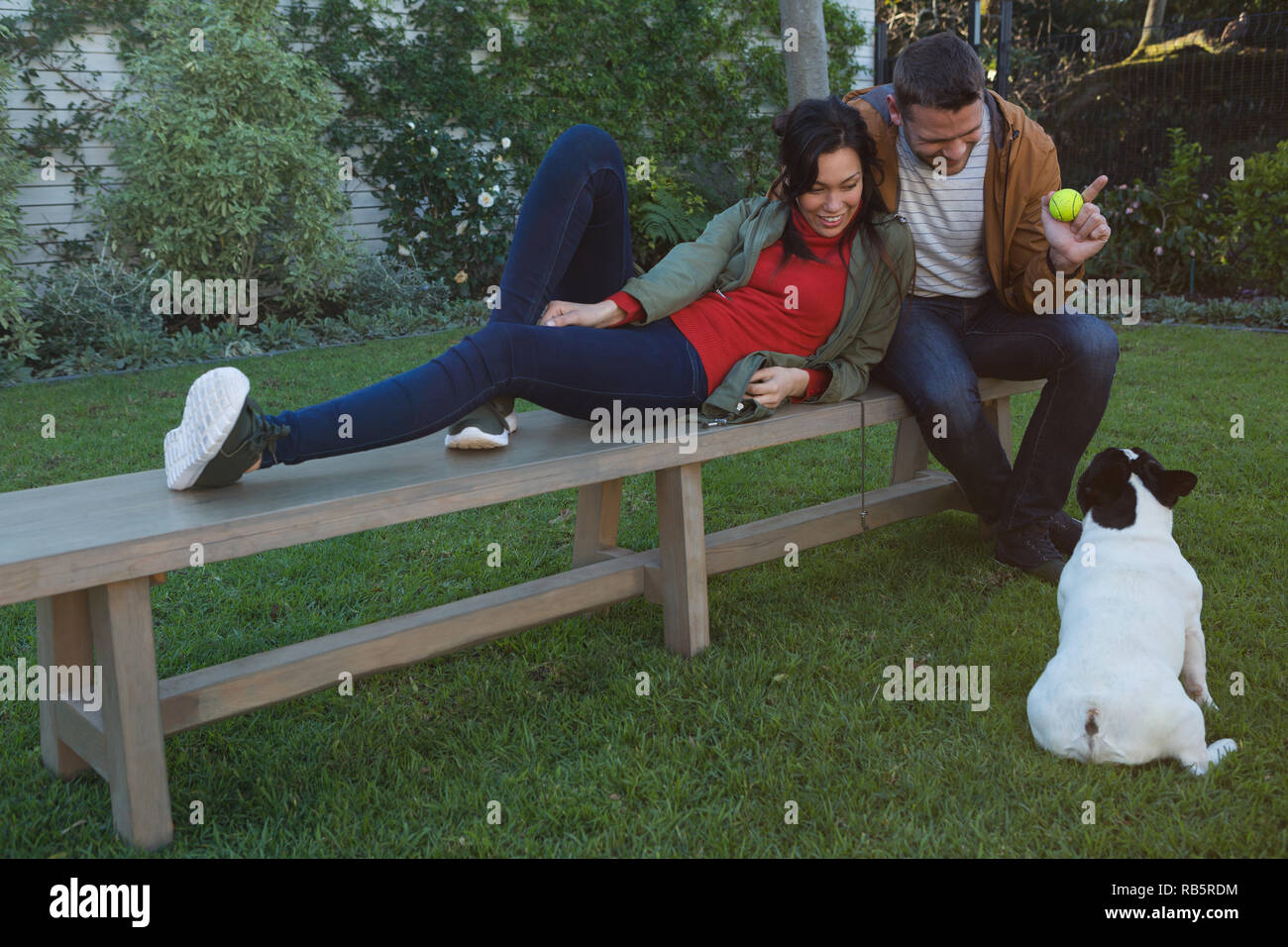 Couple Playing Dog Park Bench Stock Photos Couple Playing Dog