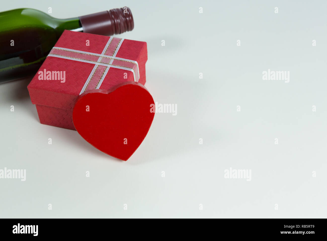 Wine Bottle With Valentine Gift And Decoration On White Background