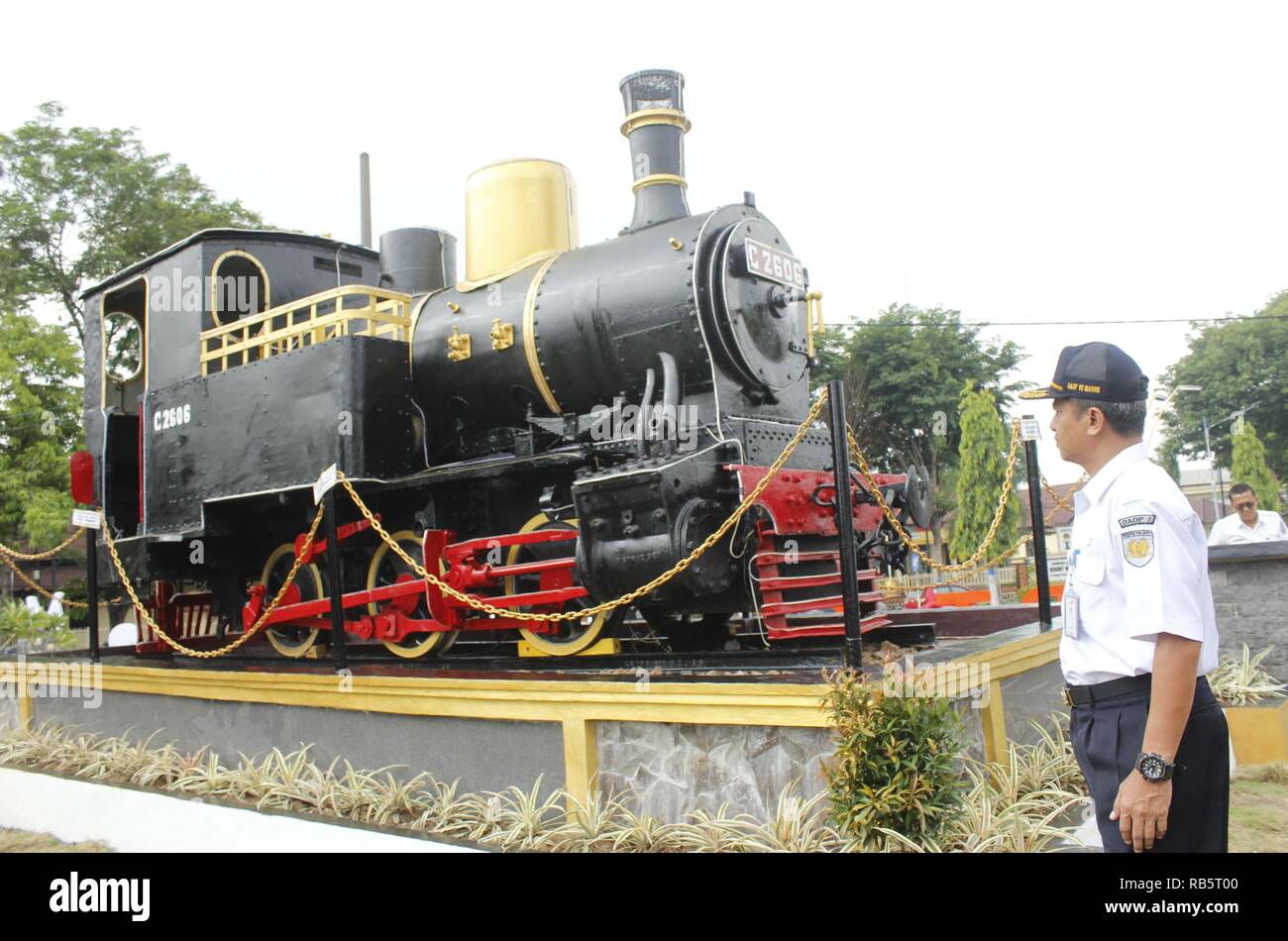 Vice President of PT. Indonesian Railroad/KAI VII Madiun Operational Area,  Heri Siswanto [right] accompanied by Deputy Vice President, Rumekso  reviewed C2606 Locomotive Monument Park near the direct crossing road [JPL]  area of ??