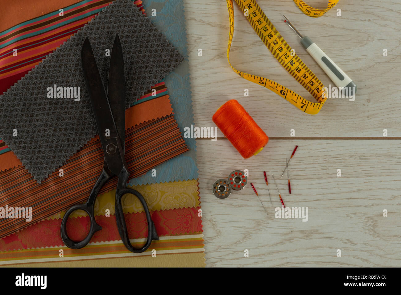 Textile, thread rolls and various equipments on a table Stock Photo - Alamy