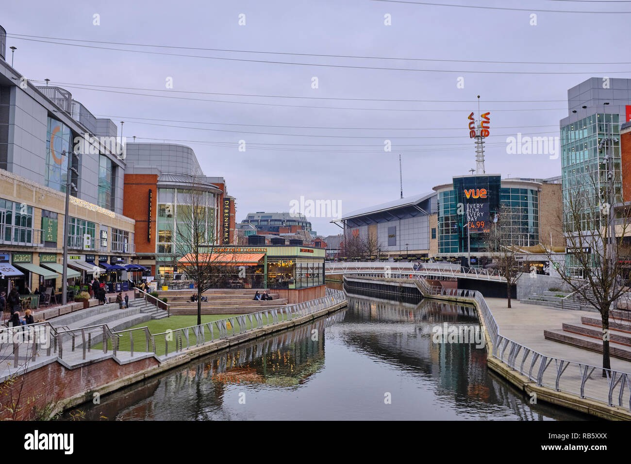Outside view of The Oracle shopping centre in Reading with shops, cafes, restaurants and a cinema either side of the River Kennet which passes through Stock Photo