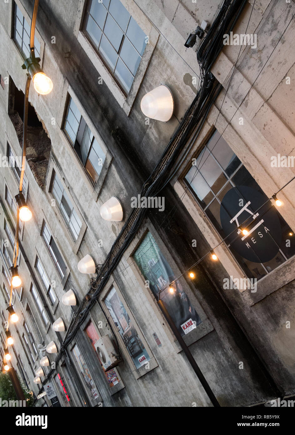 Lisbon, Portugal - May 27th 2018: Vintage factory facade with straight lamps in diagonal view Stock Photo