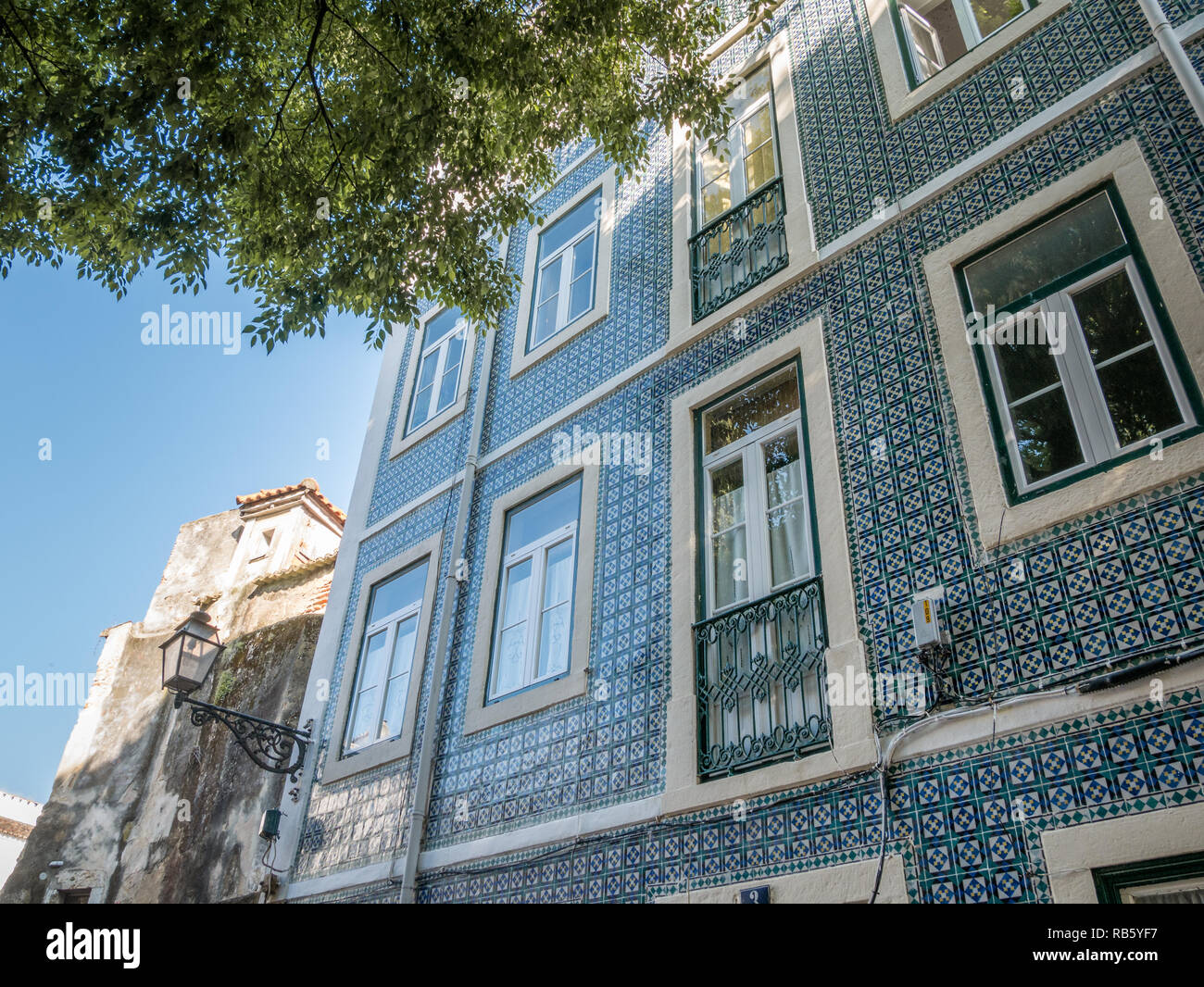 Lisbon, Portugal - May 27th 2018: Typical tradtional portuguese facade with blue white tiles on a sunny day, Lisbon, Portugal Stock Photo